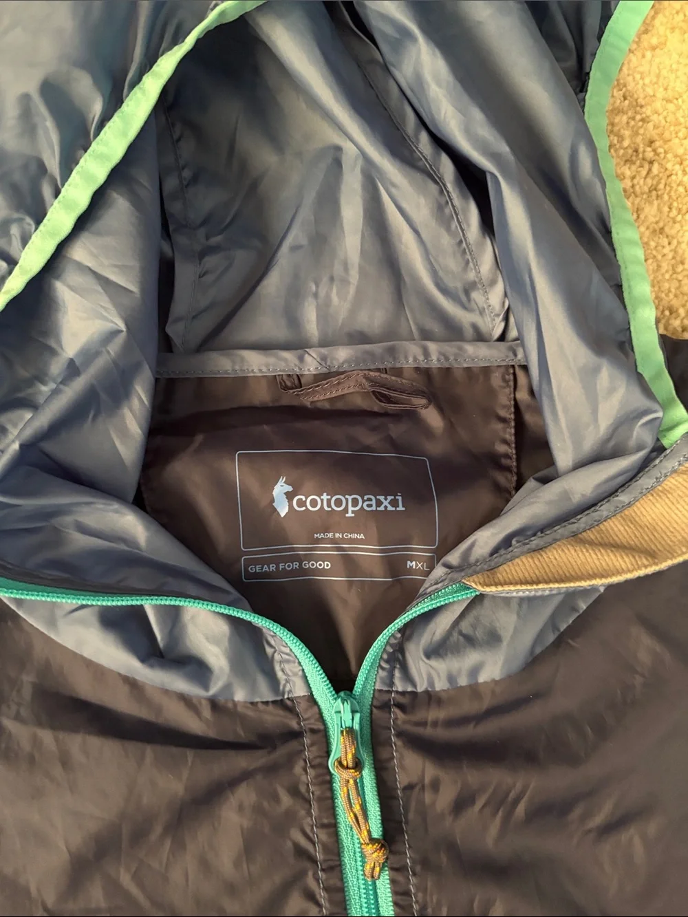 cotopaxi Navy Windbreaker with Orange and Yellow Colorblock